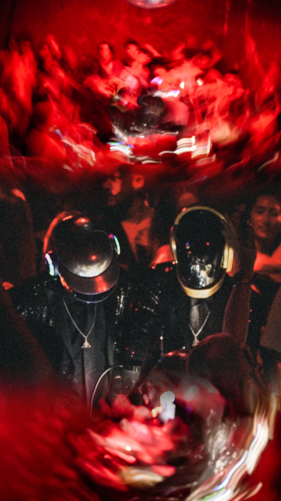 ALIVE — the two robots in red light during a live set