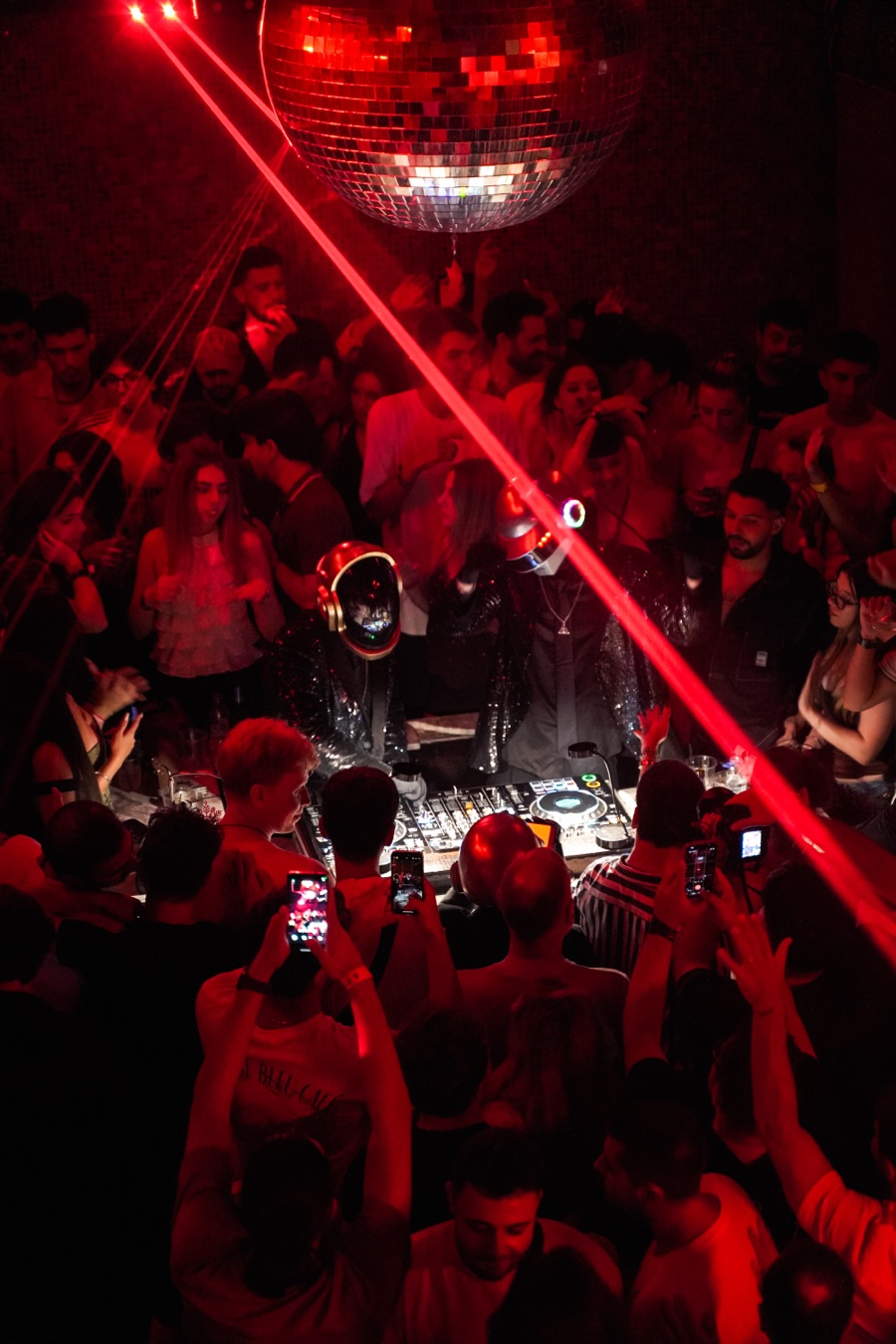 The crowd surrounding the DJ booth at an ALIVE show